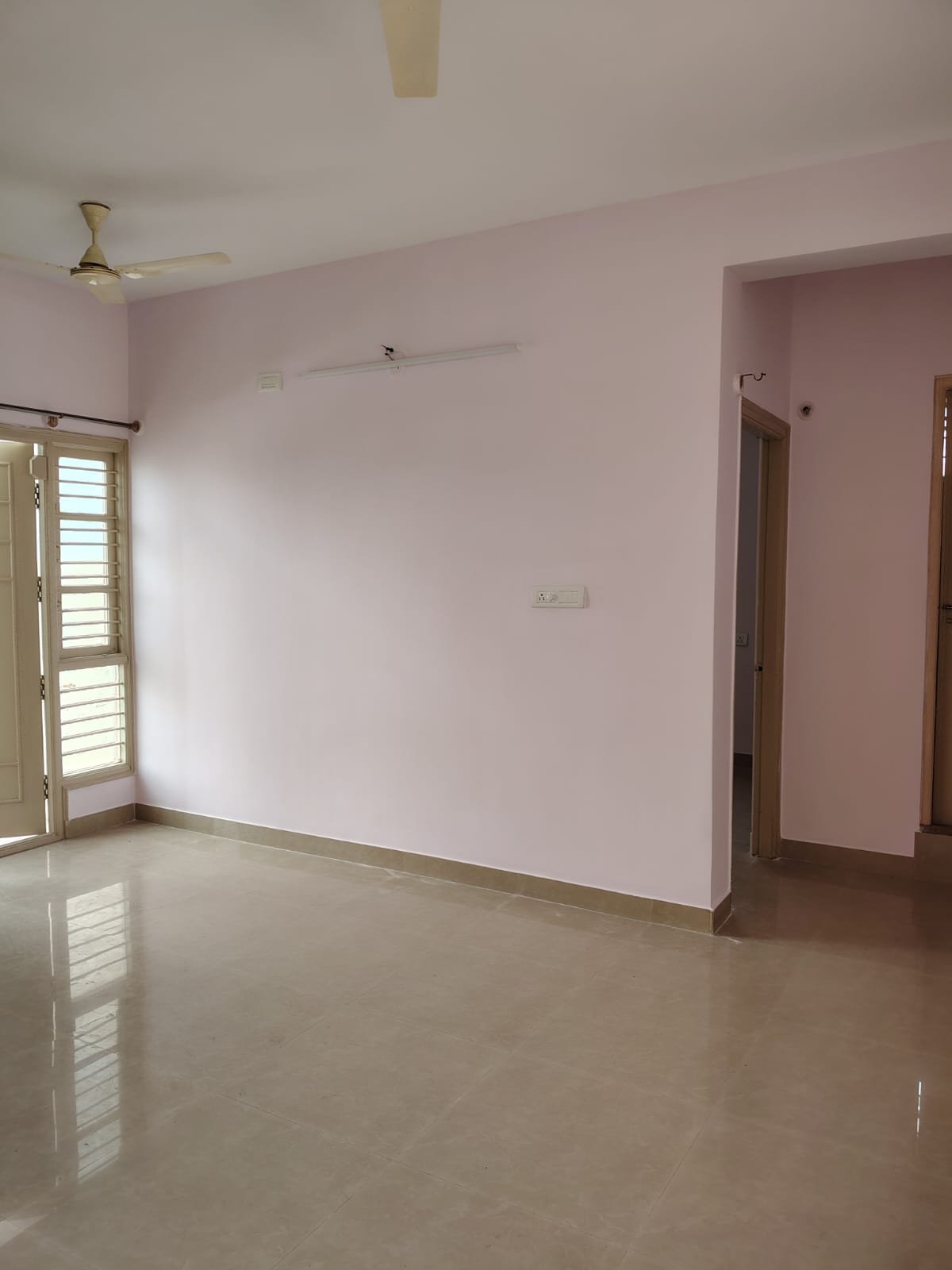 Spacious living room in 1BHK flat near Decathlon Bannerghatta Main Road with good ventilation