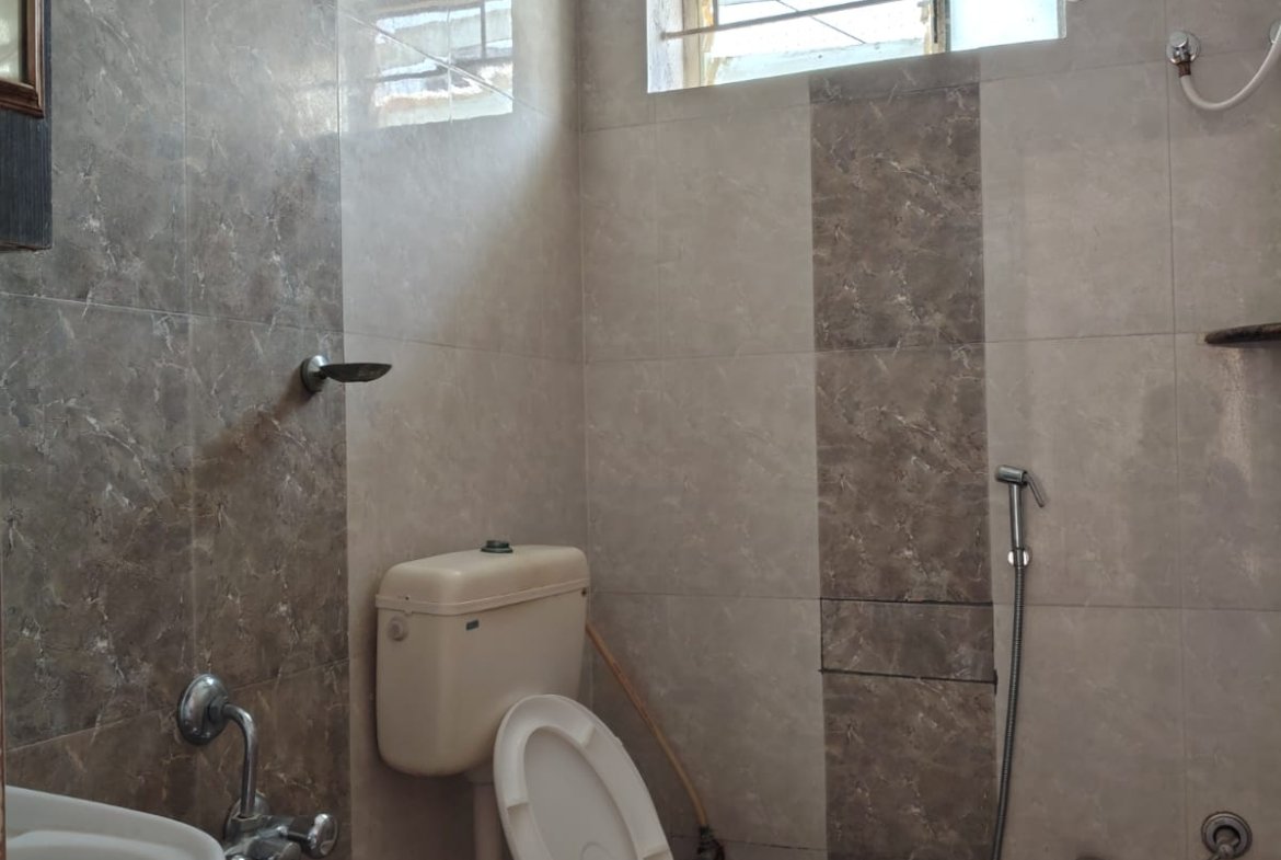 Common washroom with geyser in 1BHK flat Bannerghatta Main Road Bangalore Title: