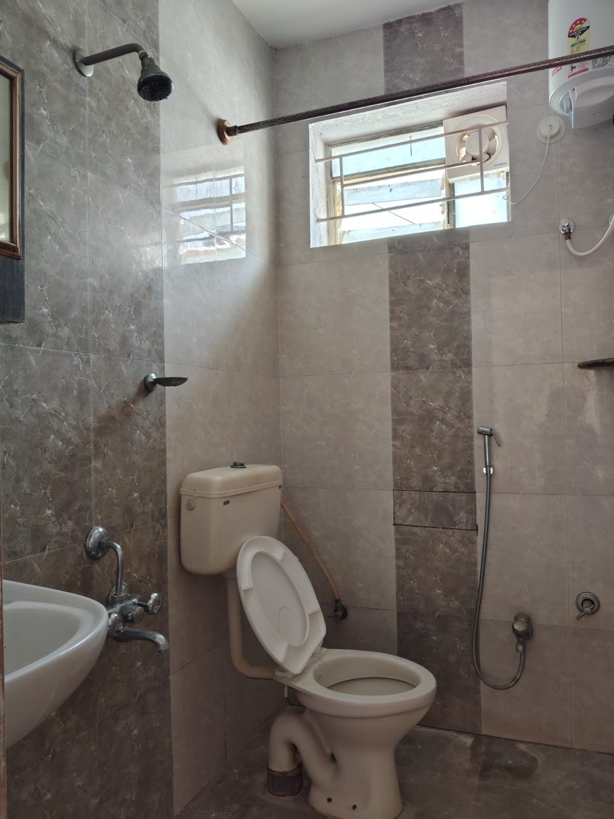 Common washroom with geyser in 1BHK flat Bannerghatta Main Road Bangalore Title: