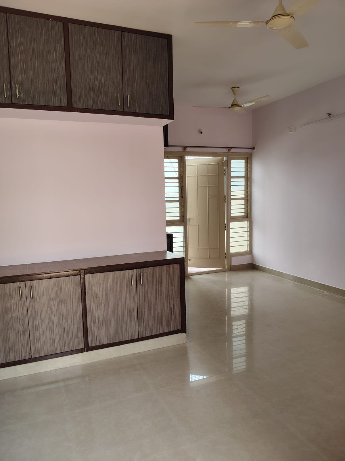 Spacious living room in 1BHK flat near Decathlon Bannerghatta Main Road with good ventilation